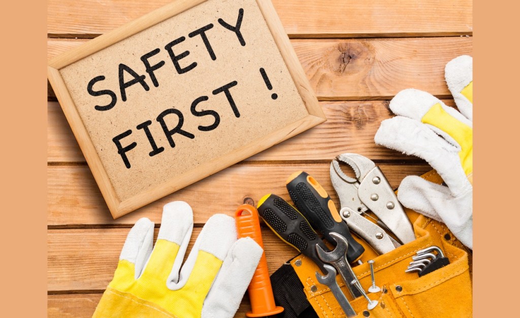 Construction worker wearing safety gear, inspecting a residential renovation site